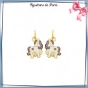 Boucles d'oreilles pendantes licorne et étoile or 18 carats